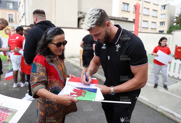 041023 - Picture shows the Wales Rugby Team visiting IME Le Rondo Croix Rouge in Versailles, a school for children with disabilities - Johnny Williams