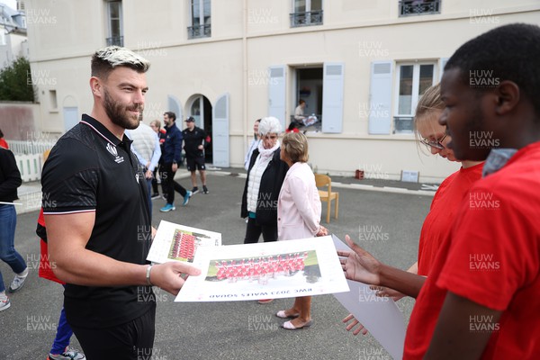 041023 - Picture shows the Wales Rugby Team visiting IME Le Rondo Croix Rouge in Versailles, a school for children with disabilities - Johnny Williams