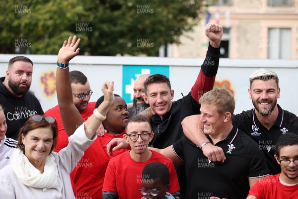 041023 - Picture shows the Wales Rugby Team visiting IME Le Rondo Croix Rouge in Versailles, a school for children with disabilities - Josh Adams, Jac Morgan and Johnny Williams