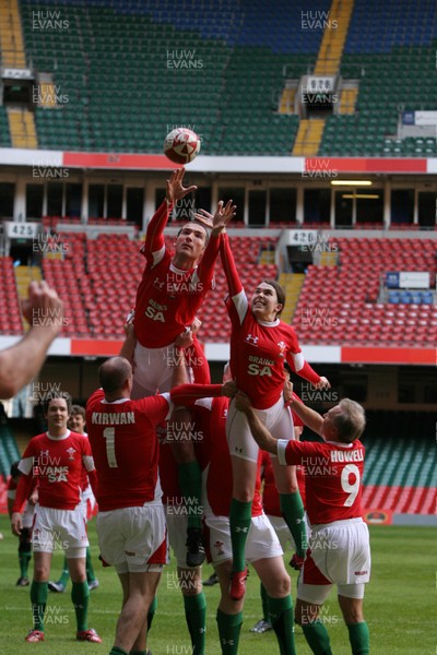 16.10.08 Wales rugby new kit launch... Daily Mail writer Chris Foy challenges Rugby World's Sarah Mockford for lineout ball at the Millennium Stadium wearing the new Welsh rugby kit. 