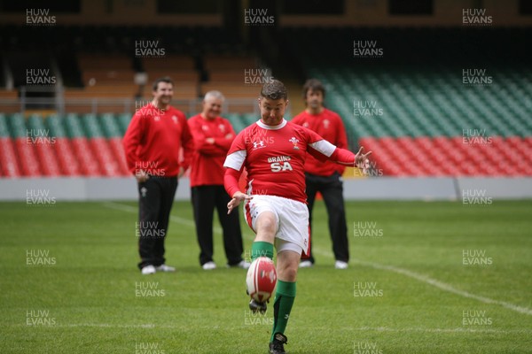 16.10.08 Wales rugby new kit launch... South Wales Evening Post writer Rob Lloyd kicks whilst watched by Warren Gatland at the Millennium Stadium wearing the new Welsh rugby kit. 