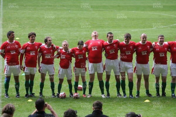 16.10.08 Wales rugby new kit launch... Media Wales writers Andy Howell and Gareth Griffiths lineup for the National Anthem at the Millennium Stadium wearing the new Welsh rugby kit. 