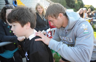 04.09.11 - Wales Rugby Training - Leigh Halfpenny signs autographs during an open training. 
