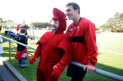 04.09.11 - Wales Rugby Training - George North has his photograph taken with a fan during an open training. 