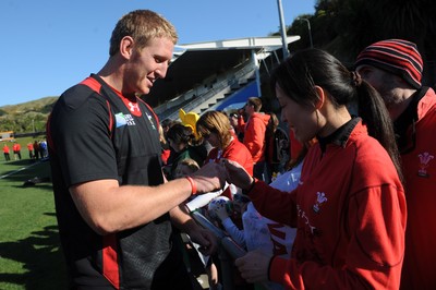 04.09.11 - Wales Rugby Training - Bradley Davies signs autographs during an open training. 
