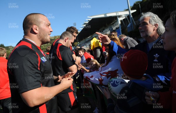 04.09.11 - Wales Rugby Training - Craig Mitchell signs autographs during an open training. 