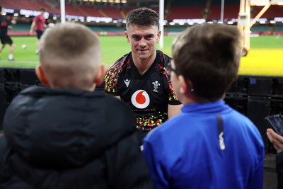 291025 - Wales Rugby Open Training - Reuben Morgan-Williams during fan signing