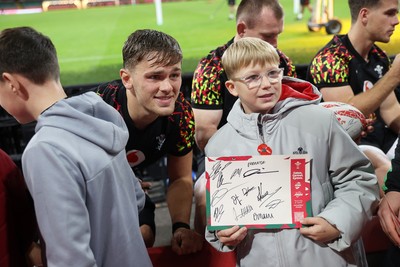 291025 - Wales Rugby Open Training - Alex Mann during fan signing