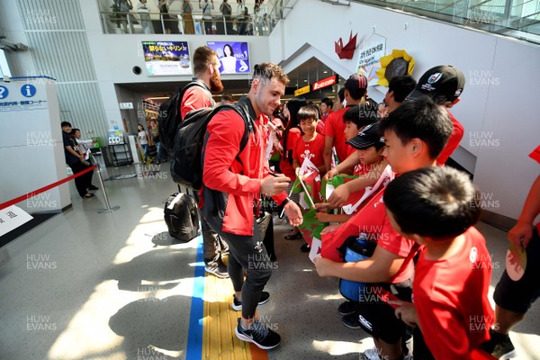 140919 - Wales Rugby Squad Arrive in Kitakyushu - Tomos Williams meets locals after arriving in Kitakyushu