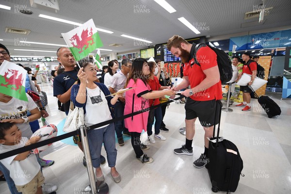 061019 - Wales Rugby Squad Travel to Oita - Jake Ball arrives in Oita Airport to be greeted by local people