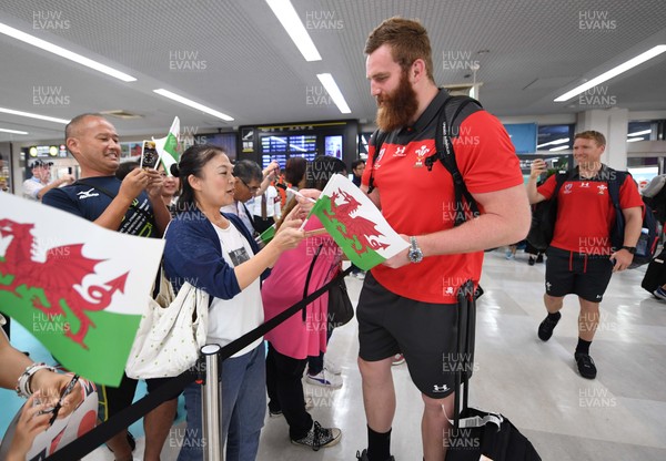 061019 - Wales Rugby Squad Travel to Oita - Jake Ball arrives in Oita Airport to be greeted by local people