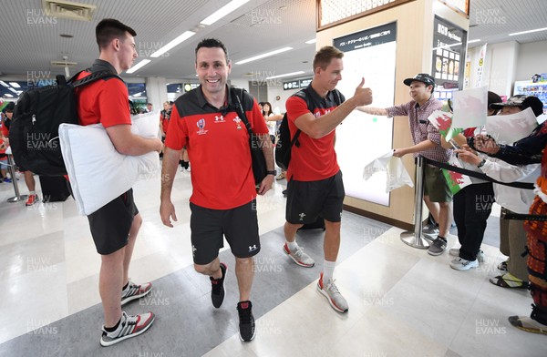 061019 - Wales Rugby Squad Travel to Oita - Adam Beard, Stephen Jones and Liam Williams arrive in Oita Airport to be greeted by local people