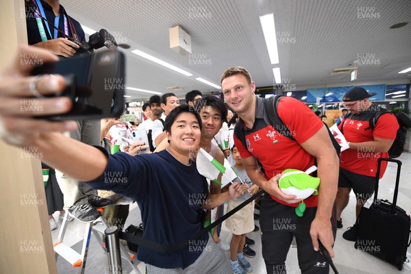 061019 - Wales Rugby Squad Travel to Oita - Dan Biggar arrives in Oita Airport to be greeted by local people