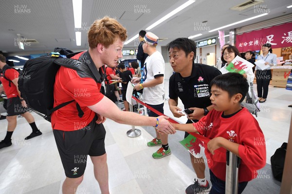 061019 - Wales Rugby Squad Travel to Oita - Rhys Patchell arrives in Oita Airport to be greeted by local people