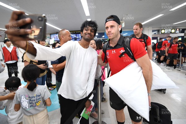 061019 - Wales Rugby Squad Travel to Oita - Gareth Davies arrives in Oita Airport to be greeted by local people