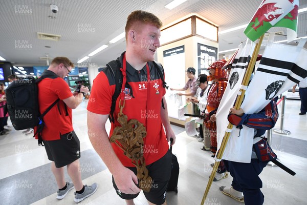 061019 - Wales Rugby Squad Travel to Oita - Rhys Carre arrives in Oita Airport to be greeted by local people