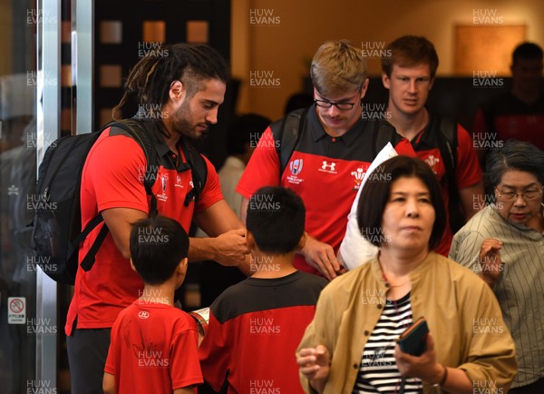 141019 - Wales Rugby Squad Travel to Oita - Josh Navidi, Aaron Wainwright and Rhys Patchell leaves the team hotel in Kumamoto