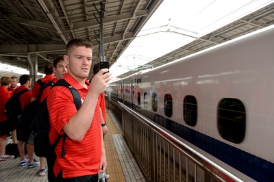 090613 - Wales Squad Travel to Tokyo -Tavis Knoyle prepares to board a bullet train in Osaka on the way to Tokyo