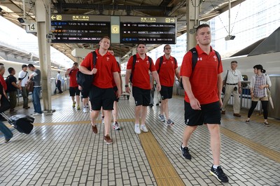 090613 - Wales Squad Travel to Tokyo -Bradley Davies, Rob McCusker, Lou Reed and Tavis Knoyle get off a bullet train after arriving in Tokyo