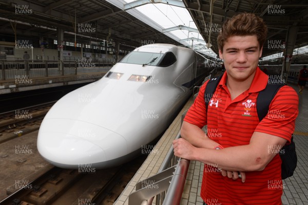 090613 - Wales Squad Travel to Tokyo -Harry Robinson prepares to board a bullet train in Osaka on the way to Tokyo