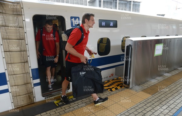 090613 - Wales Squad Travel to Tokyo -Dan Biggar and Tom Prydie get off a bullet train after arriving in Tokyo