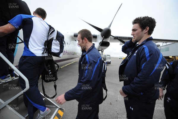 17.03.11 - Wales Rugby Team Fly to Paris - Morgan Stoddart and George North board their plane to Paris at Cardiff Airport. 