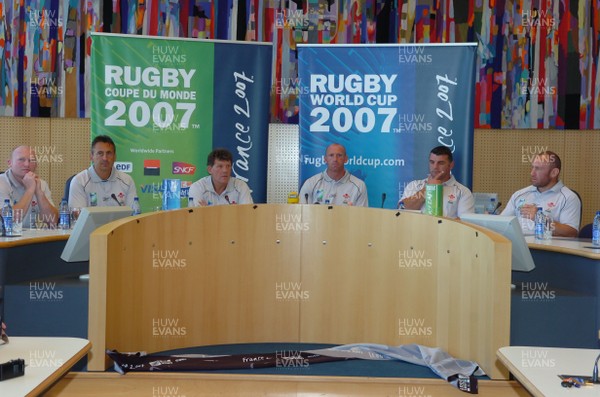 05.09.07 - Wales Rugby World Cup Training - France - (l-r)Neil Jenkins(kicking coach), Nigel Davies(attack coach), Gareth Jenkins(Head Coach), Gareth Thomas(Captain), Rowland Phillips(defence coach) and Robin Mcbryde(forwards coach) field questions during a press conference at City Hall in St Nazaire, France 