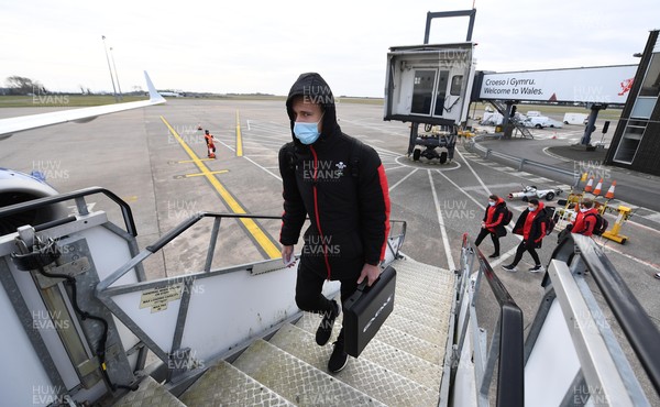 120221 - Wales Rugby Team Travel to Edinburgh - Liam Williams boards the team flight at Cardiff Airport