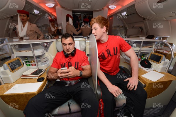 310513 - Wales Rugby Squad Travel to Japan -Andries Pretorius and Rhys Patchell make themselves comfortable for their flight from Heathrow to Osaka