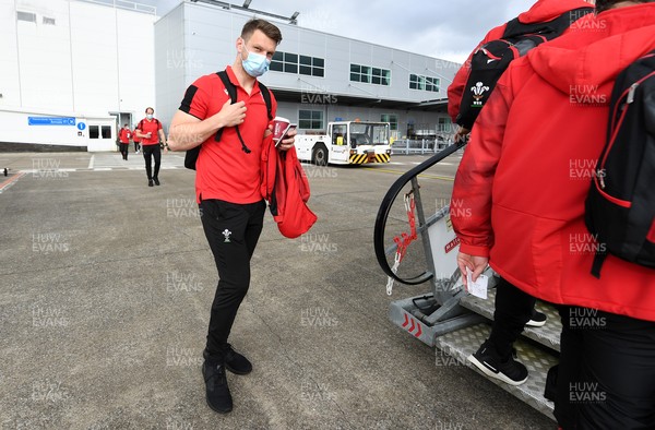 190321 - Wales Rugby team travel from Cardiff Airport to Paris ahead of their final Guinness 6 Nations match against France tomorrow - Dan Biggar boards the plane