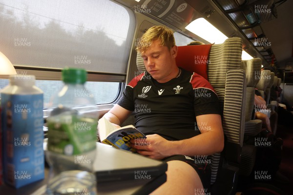 220923 - The Welsh Rugby travel on the train to Lyon for their match against Australia - Sam Costelow