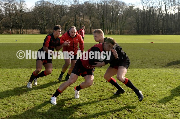 010222 - Wales Rugby Training - Louis Rees-Zammit, Gareth Williams, Jonathan Davies and Johnny McNicholl during training