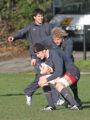 01.02.08  Wales rugby training at St Paul's School,Mortlake. Wales Alun Wyn Jones(with ball) and Duncan Jones and Mike Phillips during trainin today(FRI) 