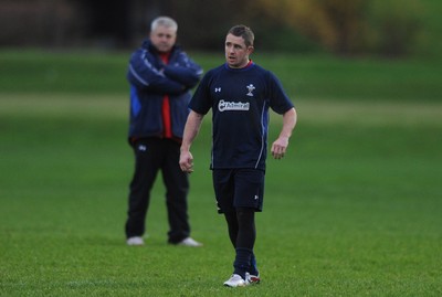 01.12.11 - Wales Rugby Training - Shane Williams  and head coach Warren Gatland look on during training. 
