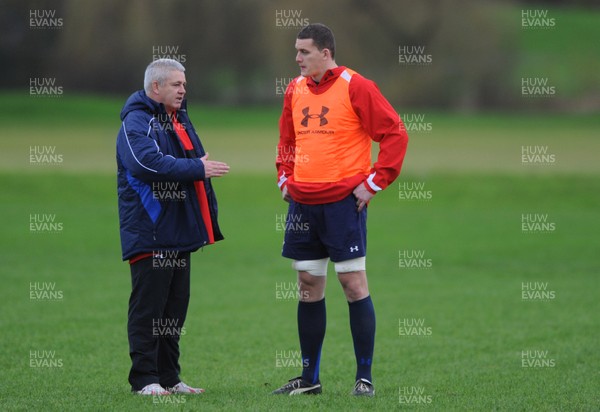 01.12.11 - Wales Rugby Training - Head coach Warren Gatland talks to Ian Evans during training. 