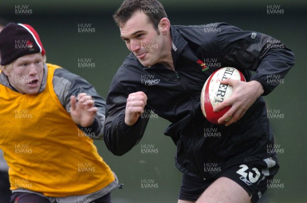 020205 - Wales Rugby Training - Robert Sidoli all smiles as he breaks past Richie Pugh