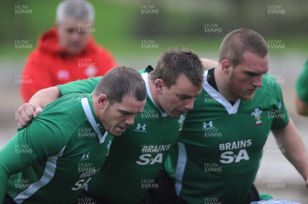 02.11.09 - Wales Rugby Training (L-R)Paul James, Matthew Rees and Gethin Jenkins pack down as head coach Warren Gatland looks on during training. 