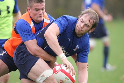 02.11.10. Wales Rugby Training... Alun Wyn Jones is tackled by Tavis Knoyle during training.. 