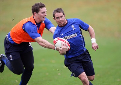 02.11.10. Wales Rugby Training... Shane Williams makes a break around George North.. 