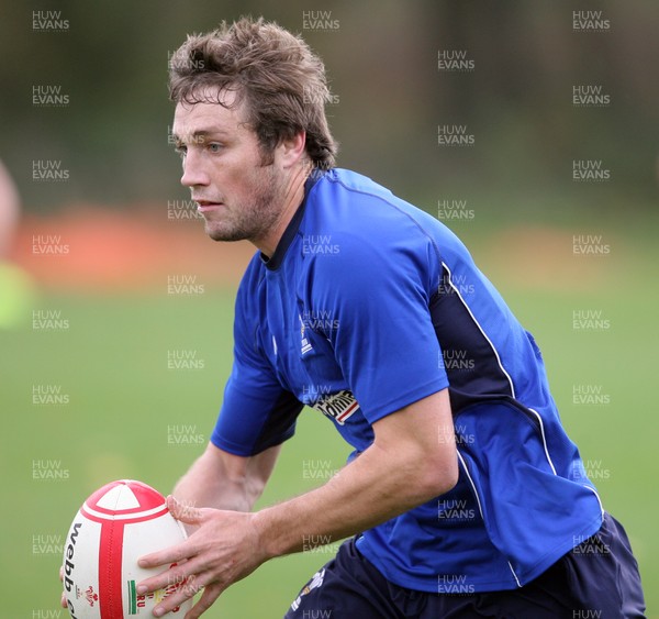 02.11.10. Wales Rugby Training... Andrew Bishop puts in a pass.. 
