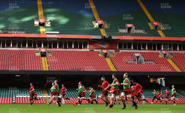 030221 - Wales Rugby Training - Players warm up during training