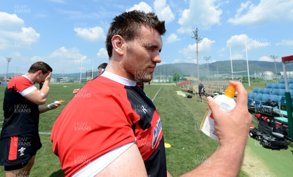 030613 - Wales Rugby Training -Emyr Phillips puts sun cream on during training