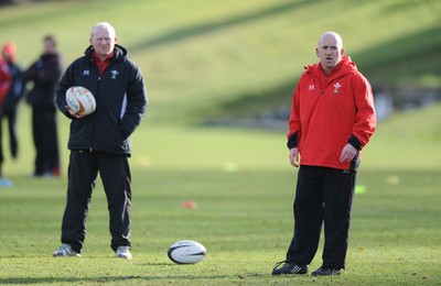 04.03.09 - Wales Rugby Training - Neil Jenkins(kicking coach) and Shaun Edwards(defence coach) looks on during training. 