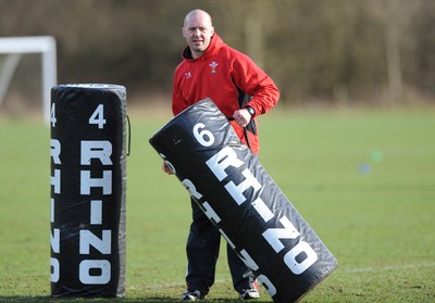 04.03.09 - Wales Rugby Training - Mark Bennett(fitness coach) moves a tackle bag during training. 