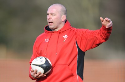 04.03.09 - Wales Rugby Training - Mark Bennett(fitness coach) makes a point during training. 