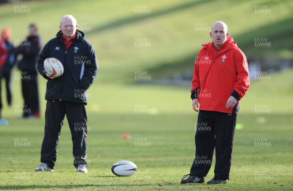 04.03.09 - Wales Rugby Training - Neil Jenkins(kicking coach) and Shaun Edwards(defence coach) looks on during training. 