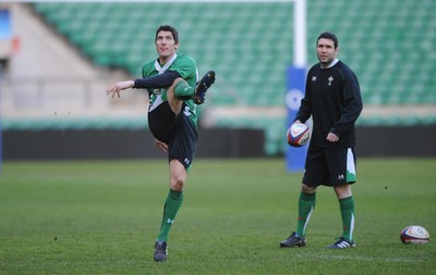 05.02.10 - Wales Rugby Training -  James Hook kicks as Stephen Jones looks on during training. 
