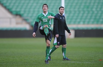 05.02.10 - Wales Rugby Training -  James Hook kicks as Stephen Jones looks on during training. 