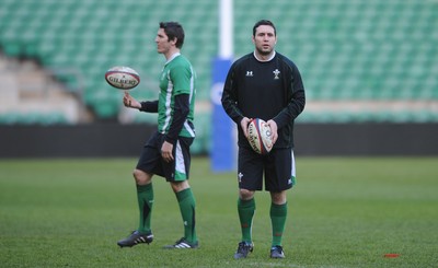 05.02.10 - Wales Rugby Training -  Stephen Jones kicks as James Hook looks on during training. 