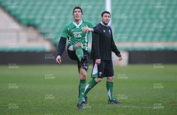 05.02.10 - Wales Rugby Training -  James Hook kicks as Stephen Jones looks on during training. 